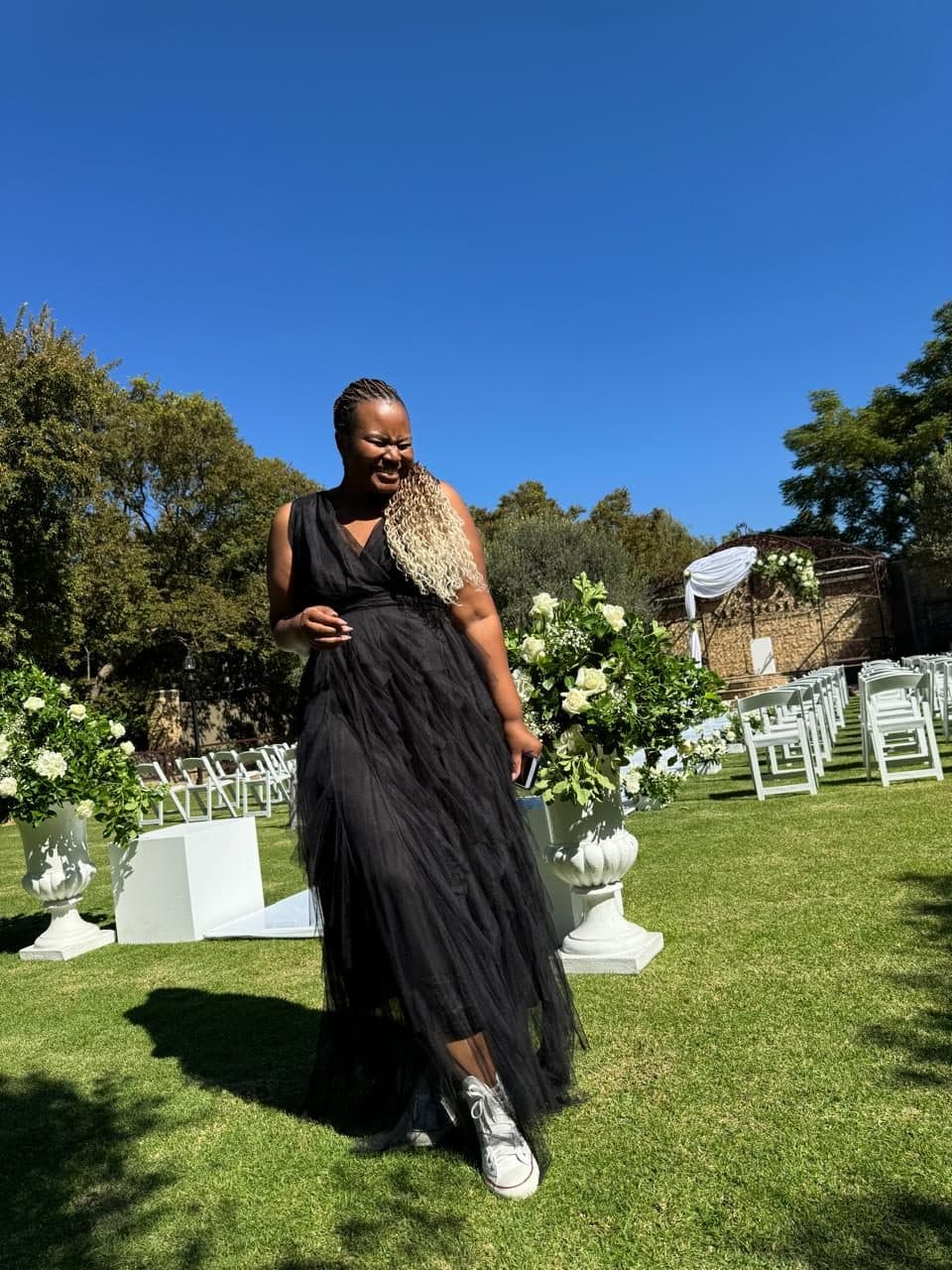 Kuhle's planner overseeing final touches at the garden ceremony