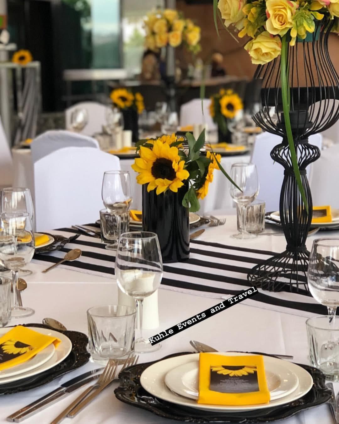 Sunflower-themed styling with monochrome striped runners